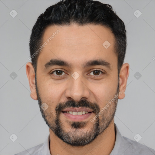 Joyful latino young-adult male with short  black hair and brown eyes