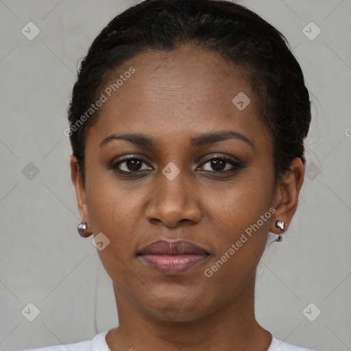 Joyful black young-adult female with short  brown hair and brown eyes