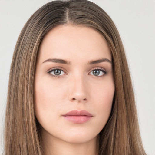 Neutral white young-adult female with long  brown hair and brown eyes