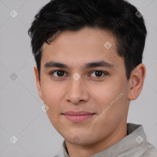 Joyful asian young-adult male with short  brown hair and brown eyes