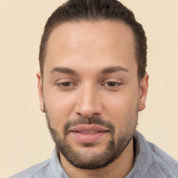 Joyful white young-adult male with short  black hair and brown eyes