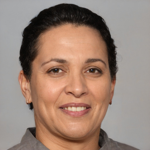 Joyful white adult female with short  brown hair and brown eyes