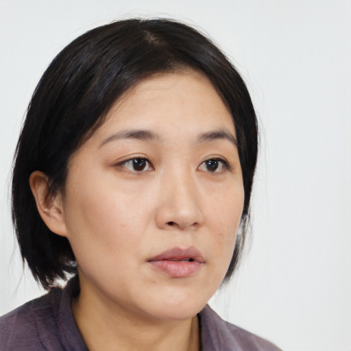 Neutral asian young-adult female with medium  black hair and brown eyes