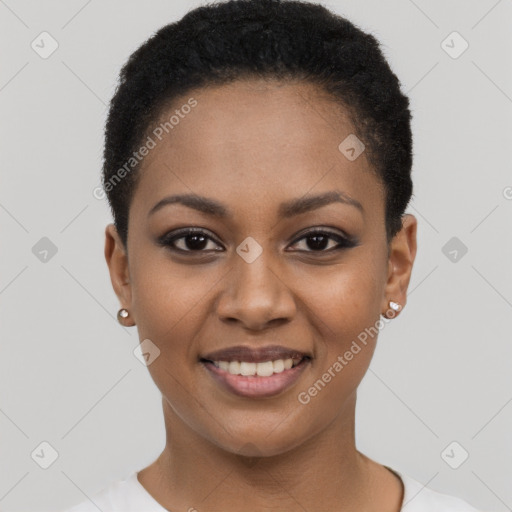 Joyful black young-adult female with short  black hair and brown eyes