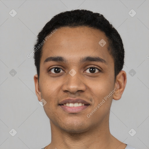 Joyful latino young-adult male with short  black hair and brown eyes