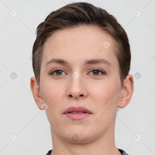 Joyful white young-adult female with short  brown hair and grey eyes