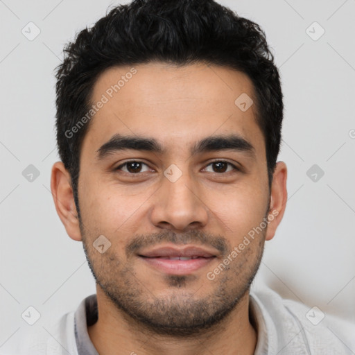 Joyful latino young-adult male with short  black hair and brown eyes