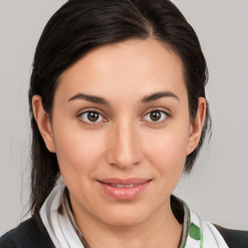 Joyful white young-adult female with medium  brown hair and brown eyes