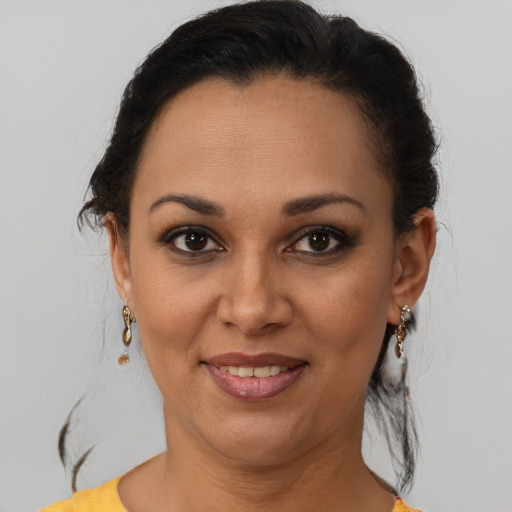 Joyful black young-adult female with medium  brown hair and brown eyes