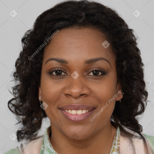 Joyful black young-adult female with medium  brown hair and brown eyes