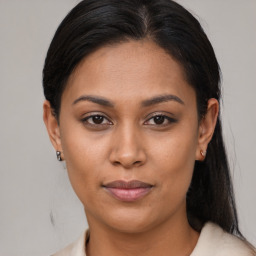 Joyful asian young-adult female with medium  brown hair and brown eyes