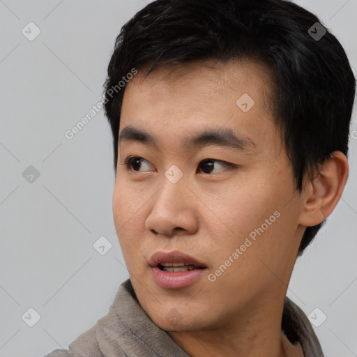 Neutral asian young-adult male with short  black hair and brown eyes