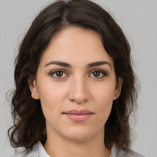 Joyful white young-adult female with medium  brown hair and brown eyes