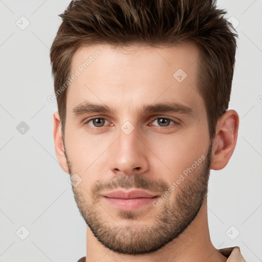 Neutral white young-adult male with short  brown hair and brown eyes