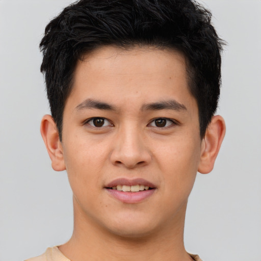 Joyful asian young-adult male with short  brown hair and brown eyes