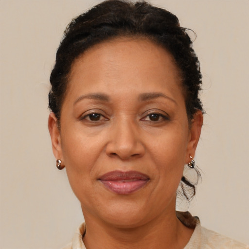 Joyful black adult female with short  brown hair and brown eyes