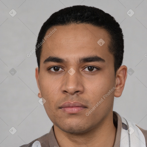 Neutral latino young-adult male with short  black hair and brown eyes