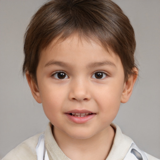 Joyful white child male with short  brown hair and brown eyes