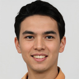 Joyful asian young-adult male with short  black hair and brown eyes