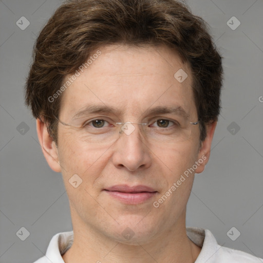 Joyful white adult male with short  brown hair and grey eyes