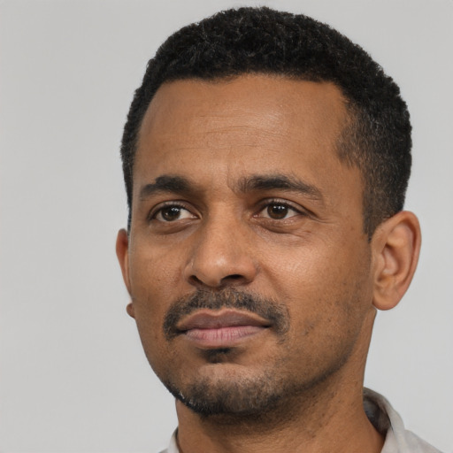 Neutral black adult male with short  black hair and brown eyes