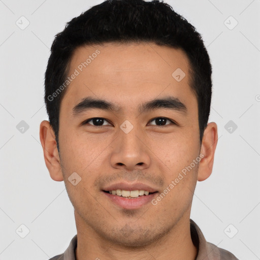 Joyful asian young-adult male with short  black hair and brown eyes