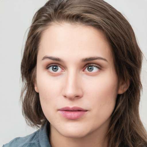 Neutral white young-adult female with long  brown hair and grey eyes