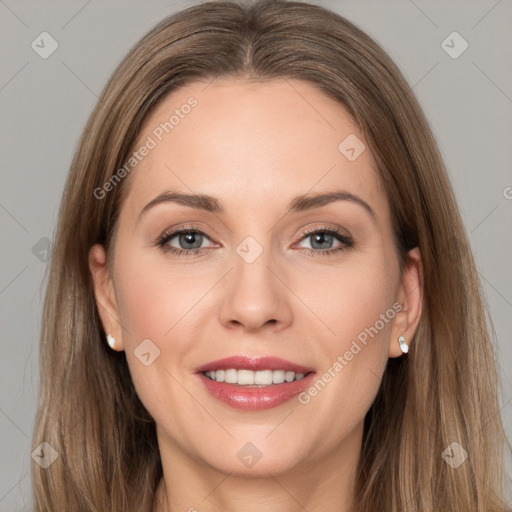 Joyful white young-adult female with long  brown hair and grey eyes