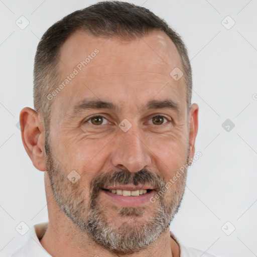 Joyful white adult male with short  brown hair and brown eyes