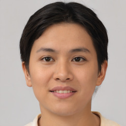 Joyful asian young-adult female with short  brown hair and brown eyes