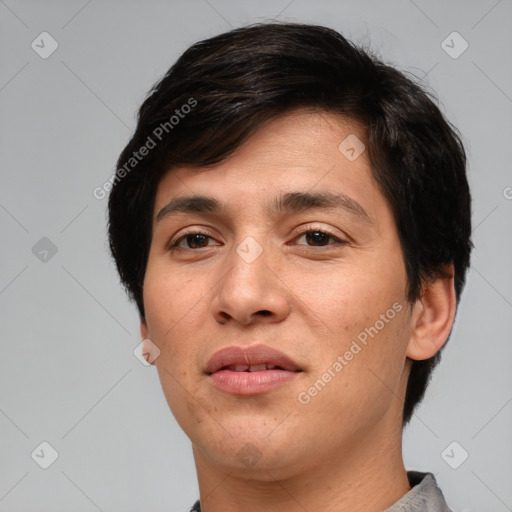 Joyful white young-adult male with short  black hair and brown eyes