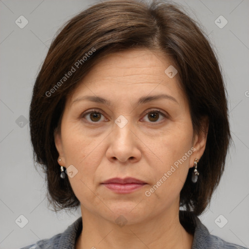 Joyful white adult female with medium  brown hair and brown eyes