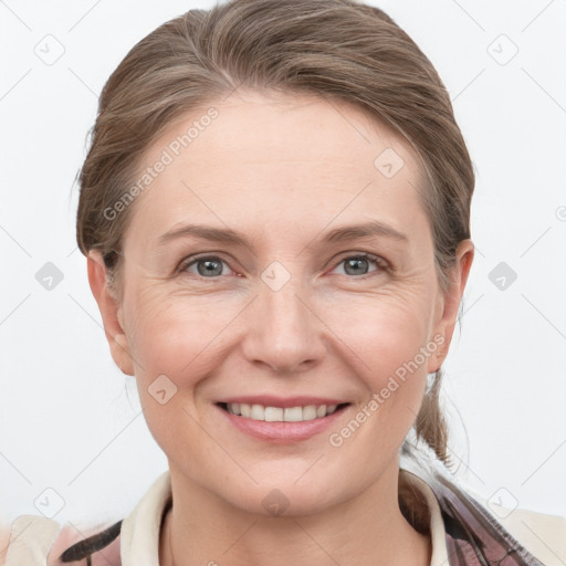 Joyful white young-adult female with medium  brown hair and grey eyes