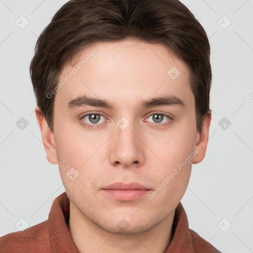 Neutral white young-adult male with short  brown hair and grey eyes