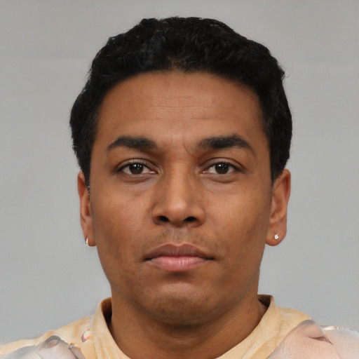 Neutral latino young-adult male with short  black hair and brown eyes