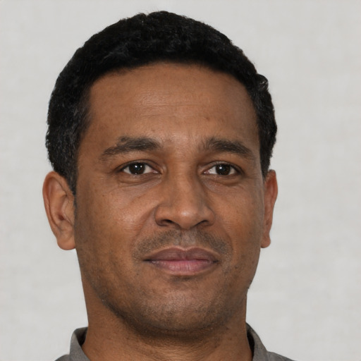 Neutral latino adult male with short  black hair and brown eyes