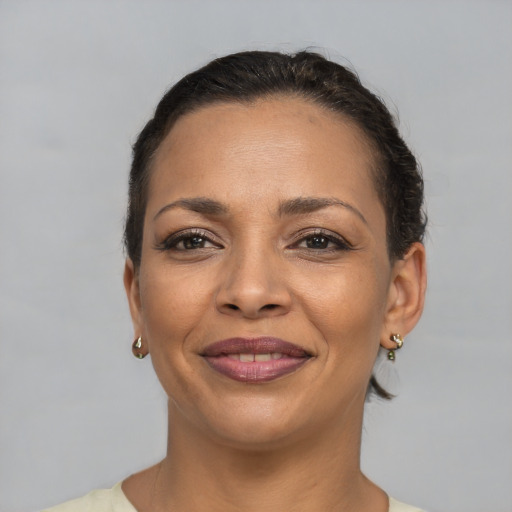 Joyful white adult female with short  brown hair and brown eyes