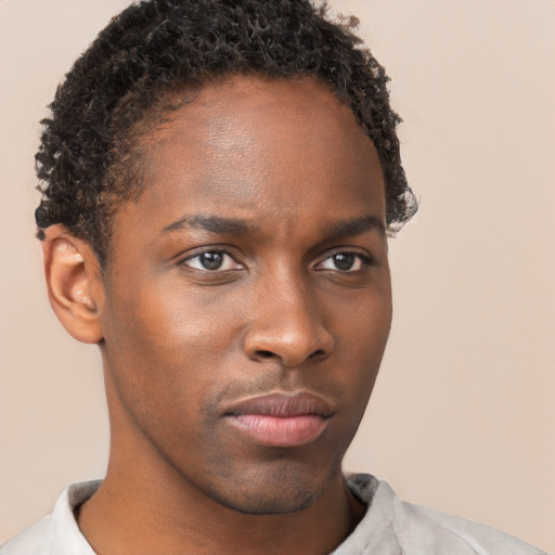 Neutral black young-adult male with short  brown hair and brown eyes