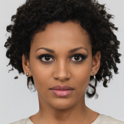 Neutral black young-adult female with short  brown hair and brown eyes