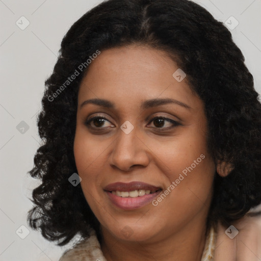 Joyful black young-adult female with long  brown hair and brown eyes