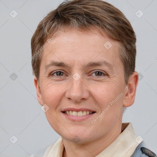 Joyful white adult female with short  brown hair and brown eyes