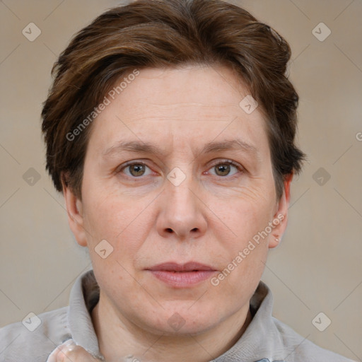 Joyful white adult female with short  brown hair and brown eyes