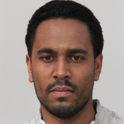 Neutral black young-adult male with short  black hair and brown eyes