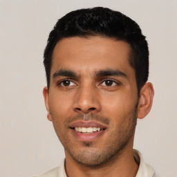 Joyful latino young-adult male with short  black hair and brown eyes