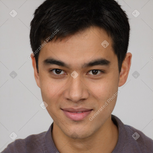 Joyful latino young-adult male with short  brown hair and brown eyes