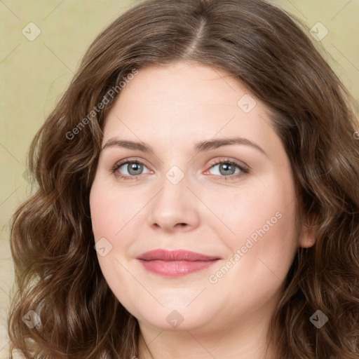 Joyful white young-adult female with long  brown hair and green eyes