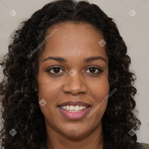 Joyful black young-adult female with long  brown hair and brown eyes