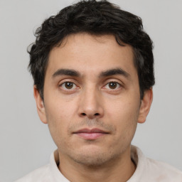 Neutral white young-adult male with short  black hair and brown eyes