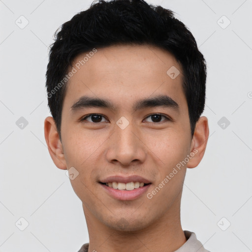 Joyful white young-adult male with short  black hair and brown eyes