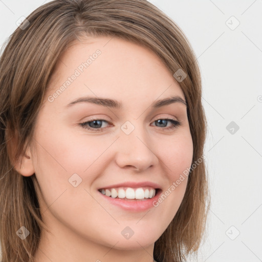 Joyful white young-adult female with long  brown hair and grey eyes